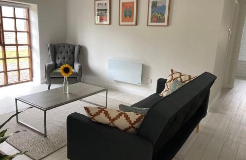 Cornwall House | Light & Airy Vaulted Barn Conversion with a View