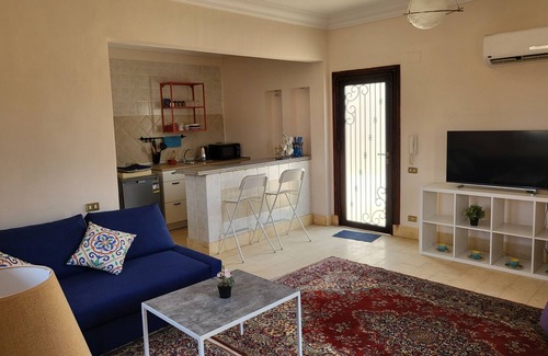 Al Rehab Apartment | Lovely one-bedroom condo with garden view