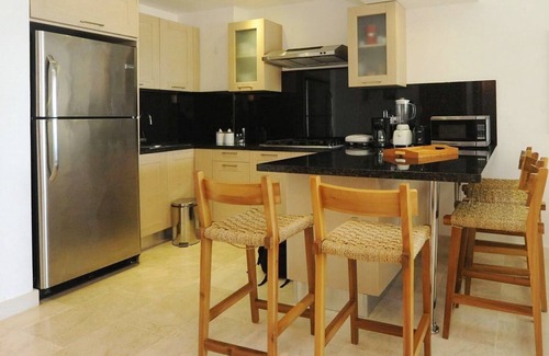 Puerto Plata Apartment | Luxury 2BD condo on sandy beach, sea views, pool, gym, tennis, golf course!