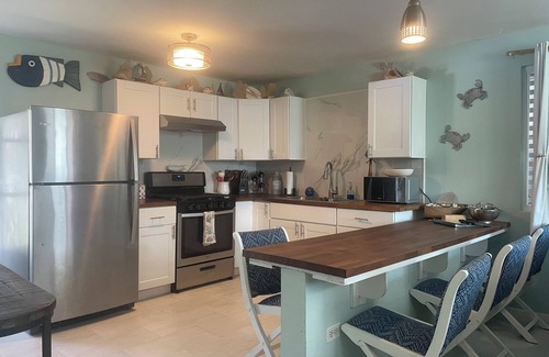 Bajo House | Malecon Beach House with beautiful backyard. Steps from the Caribbean ocean.