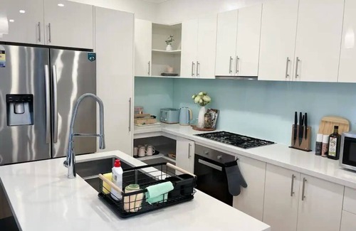 Burwood House | Modern House With Arcade Games in a Good Location
