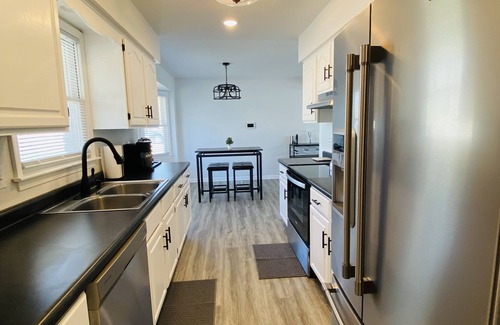 Kansas City House | Modern Oasis Near the Legends - Spacious home with games, patio, deck and more!