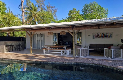 Surinam Villa | Philibert villa foot in the water with swimming pool on beach, maid, wifi