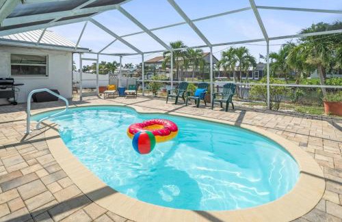 Bal Harbour House | Pirates Den a 4BR Pet-Friendly Waterfront Oasis with Pool, Dock, Personal Water Boats, Fire Pit, Game Room and Bar