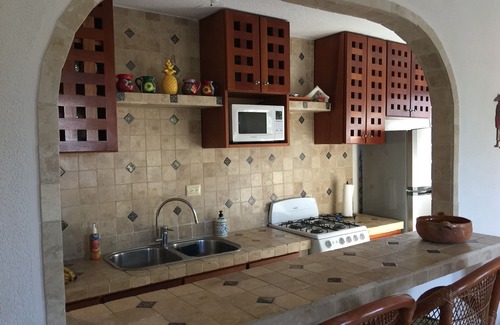 Puerto Morelos Condo | PlayaSol Beachfront Condo with large pool, steps to beach, walk to town square