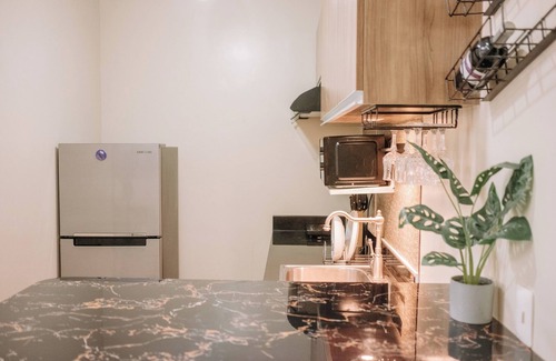 Mandurriao Condo | Playful & Charming City Loft