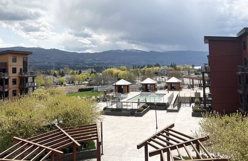 South Pandosy Condo | Poolside Mezzanine Penthouse with View