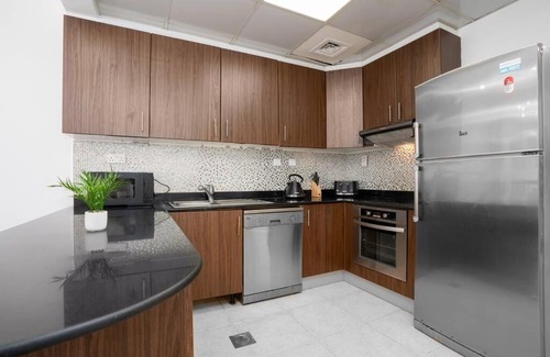 Umm Suqeim 3 Apartment | PoshBeds - Blue light over Marina