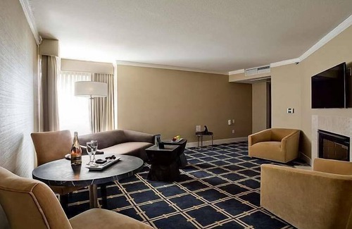 Sunnyvale West Hotel | Premier Fireplace Suite King at The Grand Hotel, Onsite Pool, Free Parking