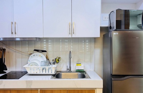 Mandurriao Condo | Relaxing Escape with Spacious Sofa Corner
