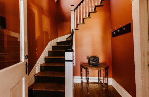 West Seventh Apartment | Retro Gem Box Victorian Steps from Irvine Park