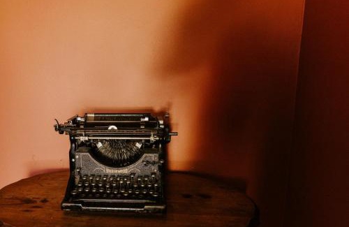 West Seventh Apartment | Retro Gem Box Victorian Steps from Irvine Park