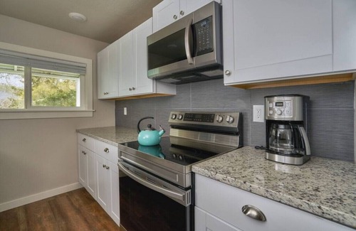 Brookings Cottage | Riverfront Cottage with Hot Tub 1/4 mi from Beach