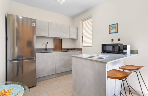 Belnem House | Romantic oceanfront studio in Bonaire with private porch and sea views. Perfect for couples seeking peace, privacy, and tropical charm.