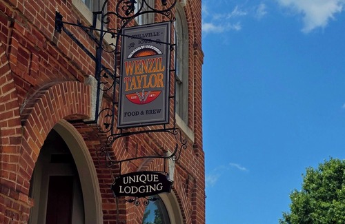 Spillville Apartment | Room 4: Sleep Where Prohibition Secrets Were Made - Historic Escape!