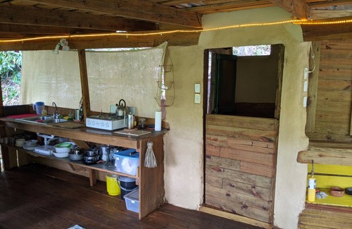 Jarabacoa Cottage | Rustic earthen two story cottage in Quintas del Bosque sleeps two couples.