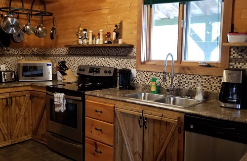 Woody Point House | Rustic Log Style Chalet in the Heart of Gros Morne National Park!