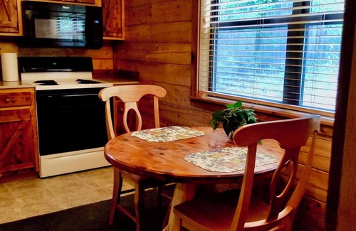 Eureka Springs Cabin | Secluded Hideaway Cabin boasting Wrap-Around Deck and Jacuzzi for two! Trail & Cave on property!