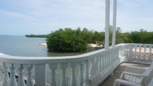 Belize City Apartment | See Belize WATERSIDE Sea View Apt for 6 with Kitchen, Balcony, Infinity POOL & Overwater Deck, 2nd Floor