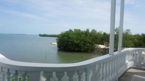 Belize City Apartment | See Belize WATERSIDE Sea View Apt for 6 with Kitchen, Balcony, Infinity POOL & Overwater Deck, 2nd Floor