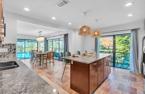 Palma Sola House | Sleeps 12 4BR/4BA Heated Saltwater Pool 2 King Suites Min to AMI & IMG