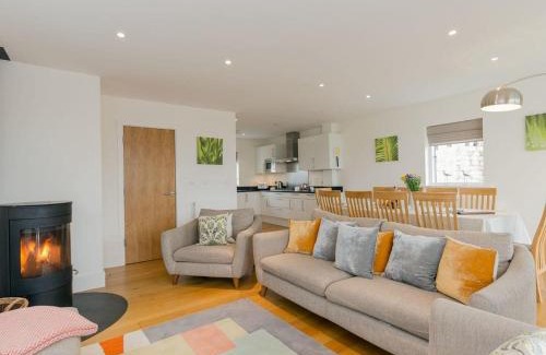 Malmesbury House | Sorrel House - stunning lakeside family home with very comfortable beds and dog friendly, free spa access