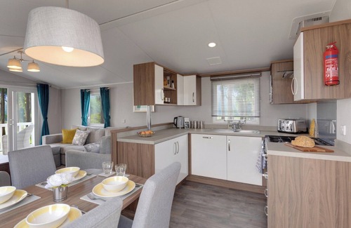 Axminster House | Spacious and luxurious 12ft-wide caravan with one double and two twin.