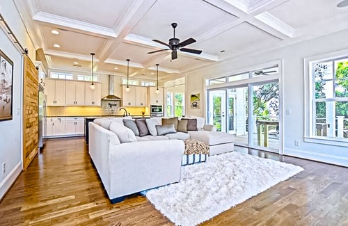 Sea Breeze House | Spacious home near the coast with outdoor shower, balconies, dock access, & AC