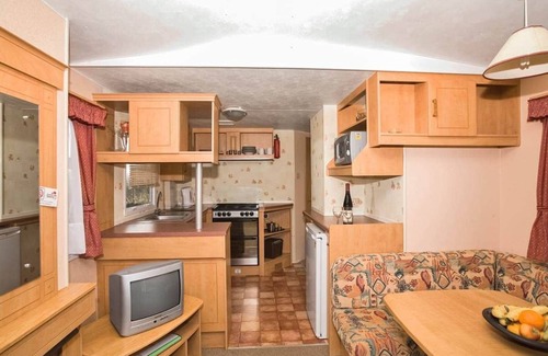 Sandown House | Spacious modern caravan with one double and two twin.