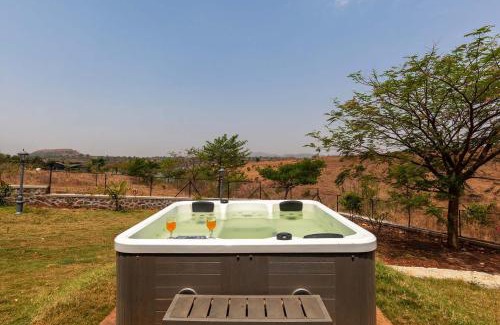 Nashik Villa | Stone House Bezze by StayVista with Lake view, Jacuzzi & Lawn - your perfect getaway