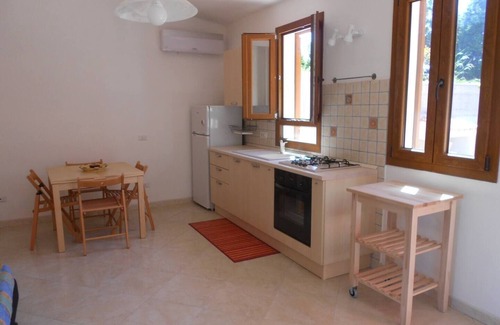 Calasetta Cottage | Studio apartment with patio in front and back terrace with veranda