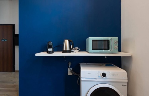 San Donato - Campidoglio Apartment | Studio apartment with double bed, armchair bed and equipped kitchenette.