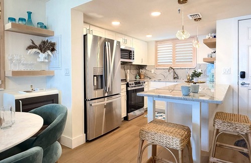 New Smyrna Beach Condo | Stylish Oceanfront Corner Condo Steps to Beach & Flagler Ave Fun