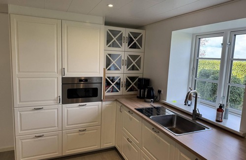 Rodby House | Super charming holiday home with space for 10 people and a huge plot.