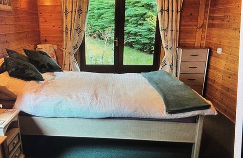 Cromarty Firth Cabin | The lodge has spectacular views of Cromarty Firth and Ben Wyvis mountain range.