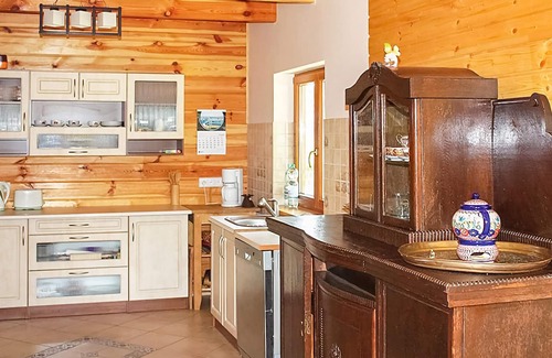 gmina Wolin House | This beautiful, well-maintained wooden house is located on a large, fenced lot.