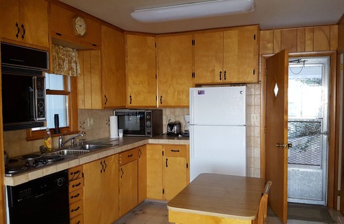 Ludington House | This Cottage offers dramatic views of Hamlin Lake with 150 feet of lakefront