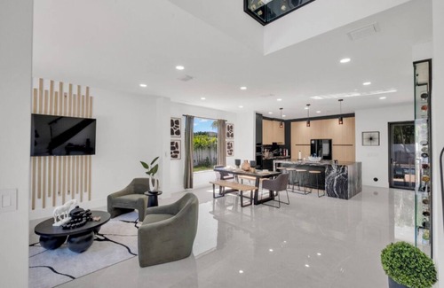 Ludlam House | This Miami Vice Villa home is a stunning Saltwater Heated pool/Jacuzzi spa Oasis