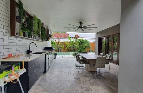 Noosaville House | Tranquil Noosa oasis with magnesium pool, putting green and waterways kayaking.