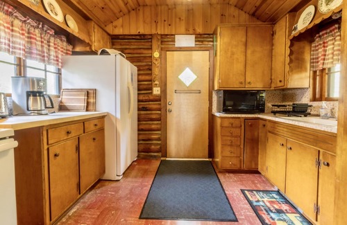 Cedar Cabin | Up North Log Cottage at Memo's Treasure With Private Lake Leelanau Waterfront