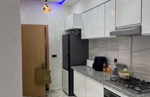 Lotissement Mehdia Apartment | Urban Oasis: Stylish and Spacious Apartment with Serene City Views