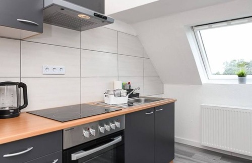 Holtriem Apartment | Vacation apartment Abendrot - House Auszeit Crusoh in Schweindorf