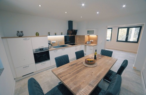 Guestrow House | Vacation home "Mien Huus an See" with lake access, jetty and bathing facilities