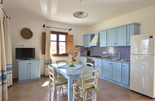 Lotzorai Apartment | Villa Menhir. Mediterranean garden. Mountain view.
