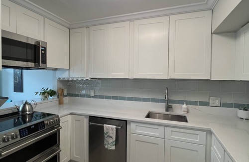 Canton House | Waterfront area with gated front yard gated parking