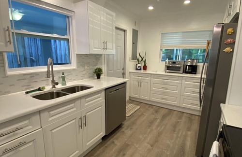 Weeki Wachee Gardens House | Weeki Wachee River Beach Retreat: with Tiki Bar, Fire Pit Hot Tub & Clear Kayaks