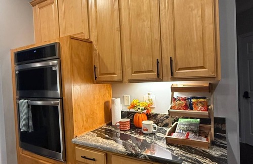 Greensboro House | Welcome to The Clovelly, a spacious 2-story vacation home that blends charm with modern comfort. Perfect for families, friends, or groups, this cozy retreat features inviting living spaces, a fully equipped modern kitchen & comfortable bedrooms.