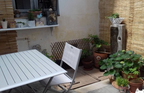 Bauge House | White room with private shower room and WC