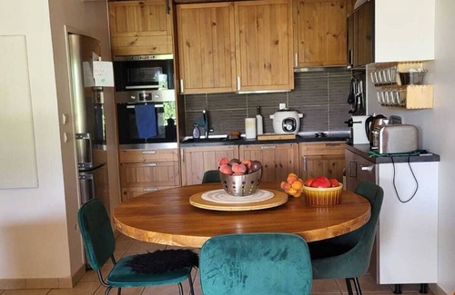 Briancon Apartment | Your corner of paradise has a greenhouse for all seasons.