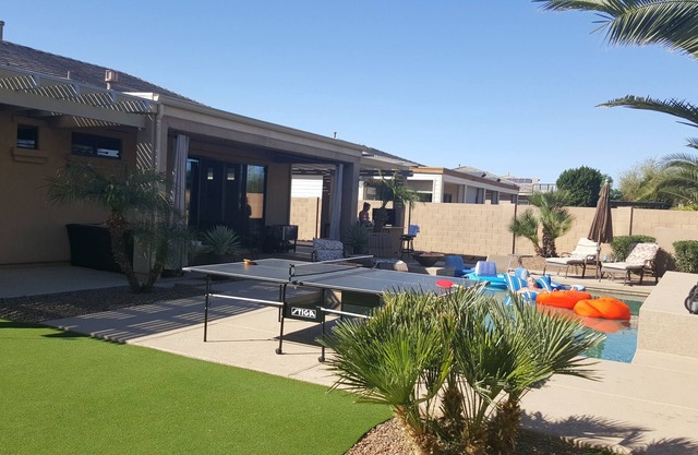 15 min to stadium 2500 sq ft house with heated pool, shuffle board, putting area